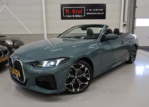 BMW 4-serie Cabrio 420i High Executive M-Sport Sportstoelen Camera Stoelverwarming Curved dashboard Navigatie Airco-ecc 19 inch Sportvelgen App connect Cape York Green metallic Zwart sportleer