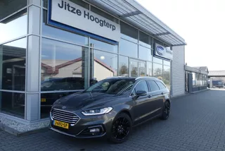 Ford Mondeo Wagon 2.0 IVCT HEV Titanium 18 INCH, ELEKT. TREKHAAK (750KG), WINTER PACK, MEMORY, CRUISE, CLIMA, NAVI, CAMERA, PDC V&amp;A, APPLE CARPLAY/ANDROID AUTO, BLIS, KEYLESS, ELEKT. PASSAGIERSSTOEL, ELEKT. ACHTERKLEP, ADAPTIEVE KOPLAMPEN, LANE ASSIST, 57.812KM