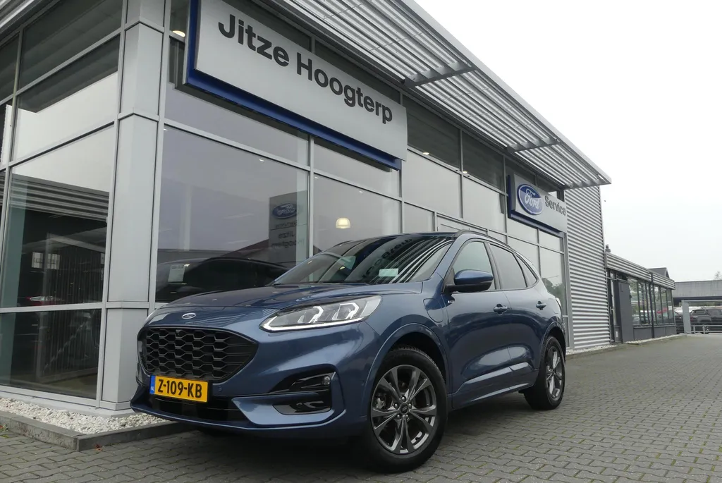 Ford Kuga 2.5 PHEV ST-Line X ELEKT. TREKHAAK, HUD, WINTER PACK, ADAPT. CRUISE, CLIMA, NAVI, CAMERA V&amp;A, PDC V&amp;A, APPLE CARPLAY/ANDROID AUTO, BLIS, KEYLESS, B&amp;O, ELEKT. ACHTERKLEP, ELEKT. STOEL, 63.260KM
